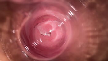 Close eye view of Mia’s small and wet vulva while she wanks
